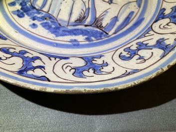 A blue, white and manganese Portuguese faience charger with a castle, 17th C.