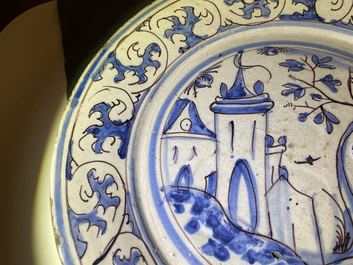 Un plat en fa&iuml;ence portugaise en bleu, blanc et mangan&egrave;se &agrave; d&eacute;cor d'un ch&acirc;teau, 17&egrave;me