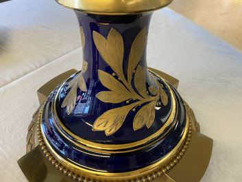 A pair of massive French S&egrave;vres-style vases with gilt bronze mounts, signed Desprez, 19th C.