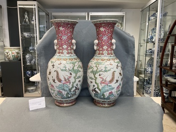 A pair of Chinese famille rose 'phoenix' vases, Tongzhi mark and of the period