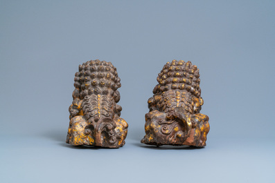 A pair of large Chinese gilt-lacquered iron models of Buddhist lions, 18/19th C.