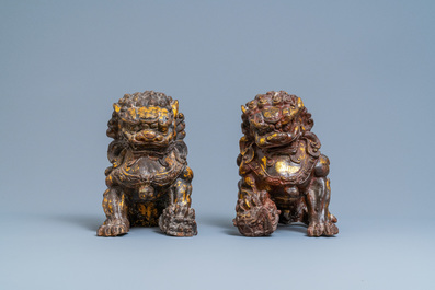 A pair of large Chinese gilt-lacquered iron models of Buddhist lions, 18/19th C.