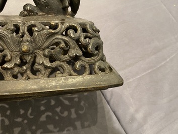 A large Chinese bronze censer and cover, Ming