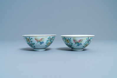 A pair of Chinese famille rose rice grain pattern 'butterfly' bowls, Qianlong mark, 19th C.