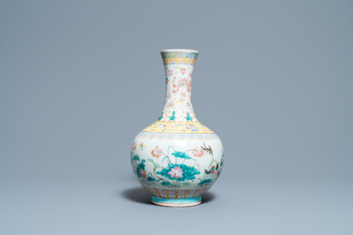 A Chinese famille rose bottle vase with mandarin ducks in a lotus pond, 19th C.