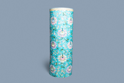 A large Chinese famille rose cylindrical vase with molded lotus scrolls, Jiaqing/Daoguang