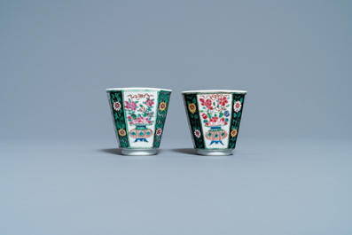 A pair of Chinese octagonal famille rose cups and saucers, Qianlong