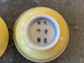 A pair of Chinese monochrome yellow wine cups, Kangxi mark and of the period