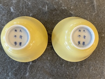 A pair of Chinese monochrome yellow wine cups, Kangxi mark and of the period