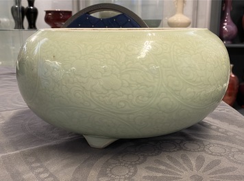 A Chinese celadon-glazed tripod censer with incised underglaze design, Kangxi