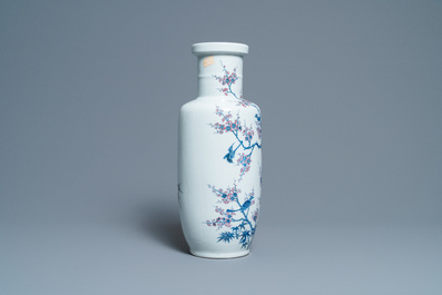 A Chinese blue, white and copper-red rouleau vase with birds among blossoming branches, 20th C.