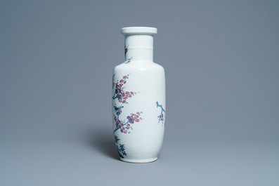 A Chinese blue, white and copper-red rouleau vase with birds among blossoming branches, 20th C.