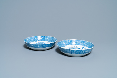 A pair of Chinese blue and white strainer dishes with ladies in a garden, Qianlong