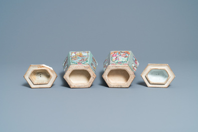 Two Chinese hexagonal Canton famille rose vases and covers, 19th C.