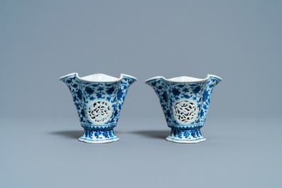 A pair of rare Chinese blue and white double-walled reticulated trilobed libation cups, Qianlong