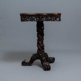 A Chinese carved wooden side table with marble chessboard top, 19th C.