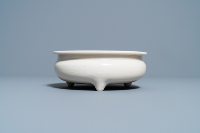 A Chinese Dehua blanc de Chine tripod censer with an incised design, Kangxi