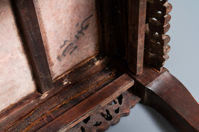 A Chinese carved wooden stand with marble top, 19th C.