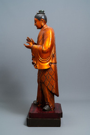 A massive Chinese gilded wooden figure of a standing male, 18/19th C.