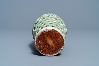 A Chinese reticulated monochrome Longquan celadon brush pot, Ming