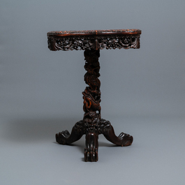 A Chinese carved wooden side table with marble chessboard top, 19th C.