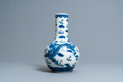 A Chinese blue and white 'dragons' bottle vase, Yongzheng mark, 19th C.