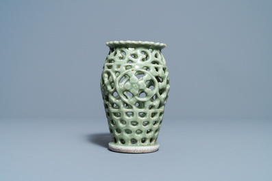 A Chinese reticulated monochrome Longquan celadon brush pot, Ming