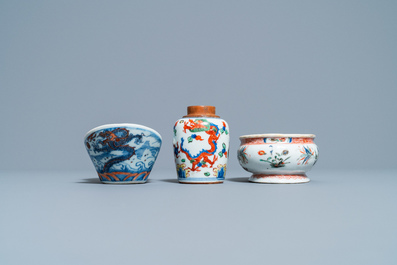 A Chinese doucai bowl, a famille verte spice box and a wucai tea caddy, Kangxi and later