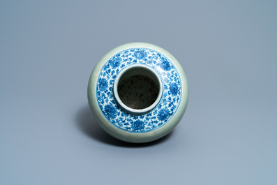 A Chinese celadon-ground and blue and white 'lotus scroll' jar, Ming