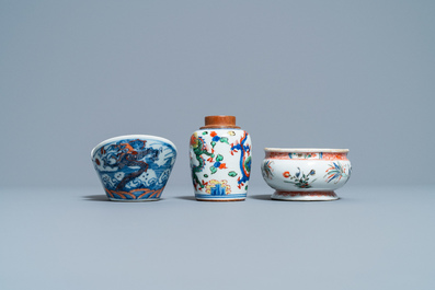 A Chinese doucai bowl, a famille verte spice box and a wucai tea caddy, Kangxi and later