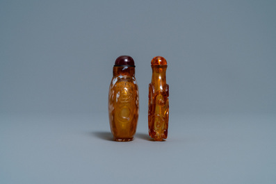 Two Chinese amber-simulating glass snuff bottles, 18/19th C.