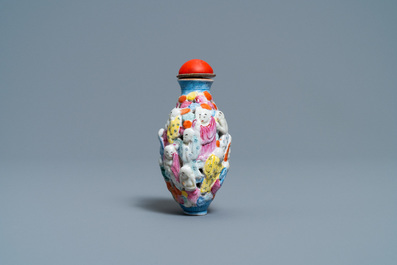 A Chinese famille rose molded, reticulated and double-walled '18 Luohans' snuff bottle, Qianlong mark, 19th C.