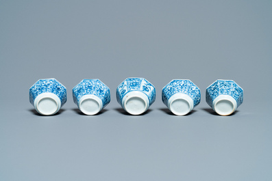 Sixteen Chinese blue and white saucers and fourteen cups, Kangxi