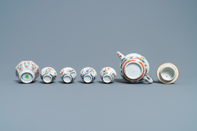 A Chinese famille verte teapot, seven saucers and five cups, Kangxi