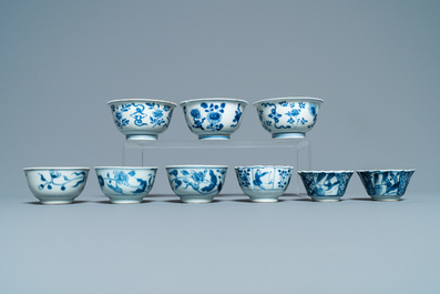 Sixteen Chinese blue and white saucers and fourteen cups, Kangxi