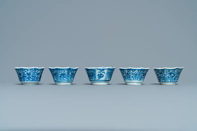 Sixteen Chinese blue and white saucers and fourteen cups, Kangxi