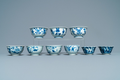 Sixteen Chinese blue and white saucers and fourteen cups, Kangxi