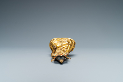 A Sino-Tibetan coral- and turquoise-inlaid gilt bronze figure of Tara, 18th C.