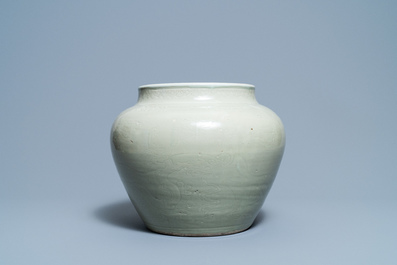 A globular Chinese monochrome celadon 'dragon' vase, Kangxi