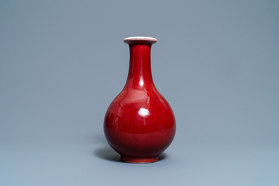 A Chinese monochrome langyao-glazed bottle vase, marked 'Made in Jingdezhen in 1955'