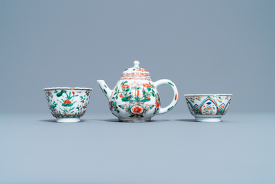 A Chinese famille verte teapot, two cups and three saucers, Kangxi