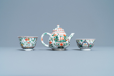 A Chinese famille verte teapot, two cups and three saucers, Kangxi