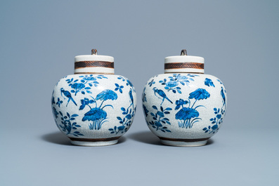 A pair of Chinese blue and white Nanking crackle-glazed jars and covers, 19th C.