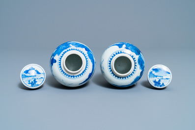 A pair of Chinese blue and white covered jars and a pair of famille rose vases, 19th C.