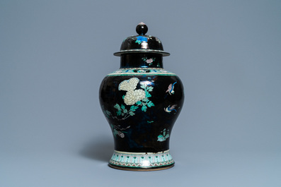 A Chinese famille noire vase and cover, 19th C.