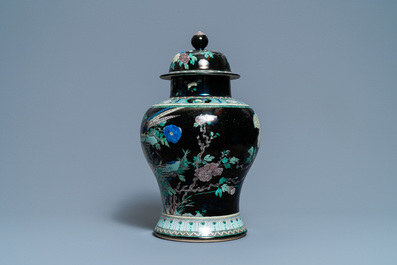 A Chinese famille noire vase and cover, 19th C.