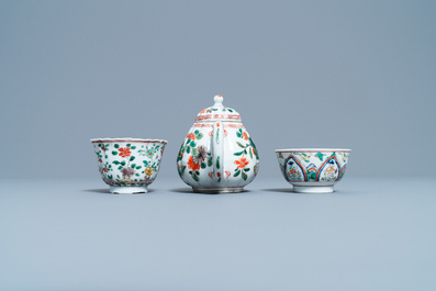 A Chinese famille verte teapot, two cups and three saucers, Kangxi