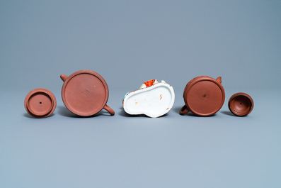 Two Chinese Yixing stoneware teapots and a famille rose 'Shou Lao' group, Kangxi and 20th C.