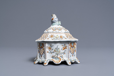A Dutch Delft polychrome petit feu tobacco box and cover with a seated Chinaman, 18th C.