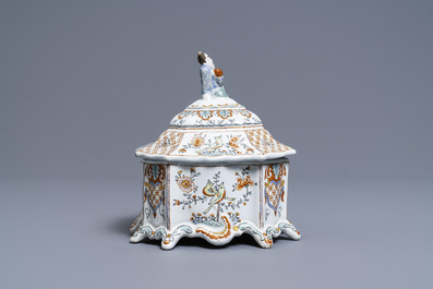 A Dutch Delft polychrome petit feu tobacco box and cover with a seated Chinaman, 18th C.